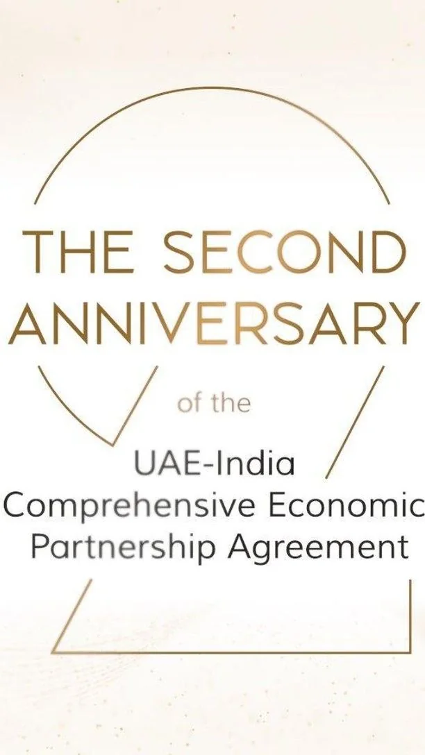 Reel cover on cream: “The second anniversary of the UAE–India Comprehensive Economic Partnership Agreement” in gold and grey type, framed by thin gold arcs and lines.