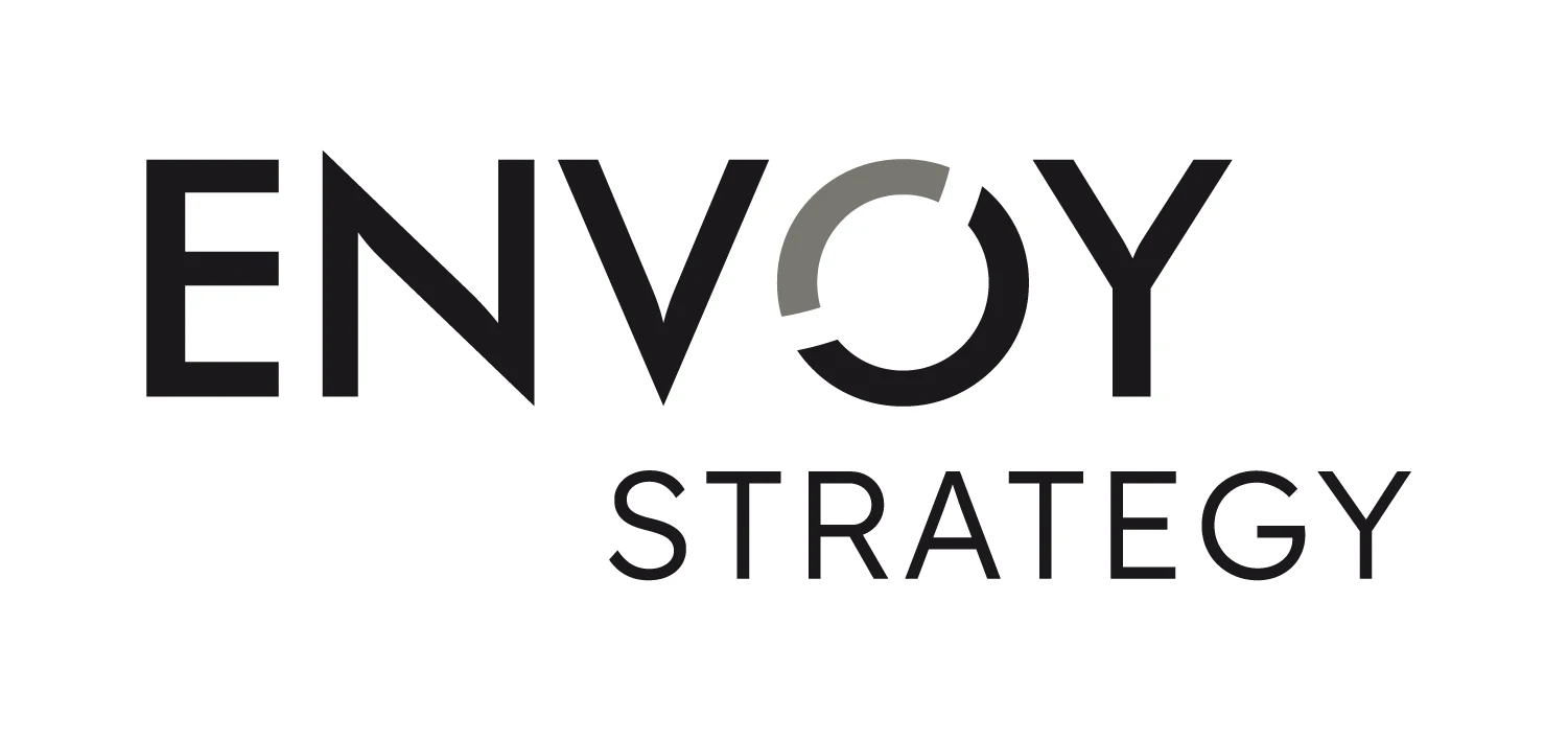 The logo in charcoal on white, with the grey arc in the O.