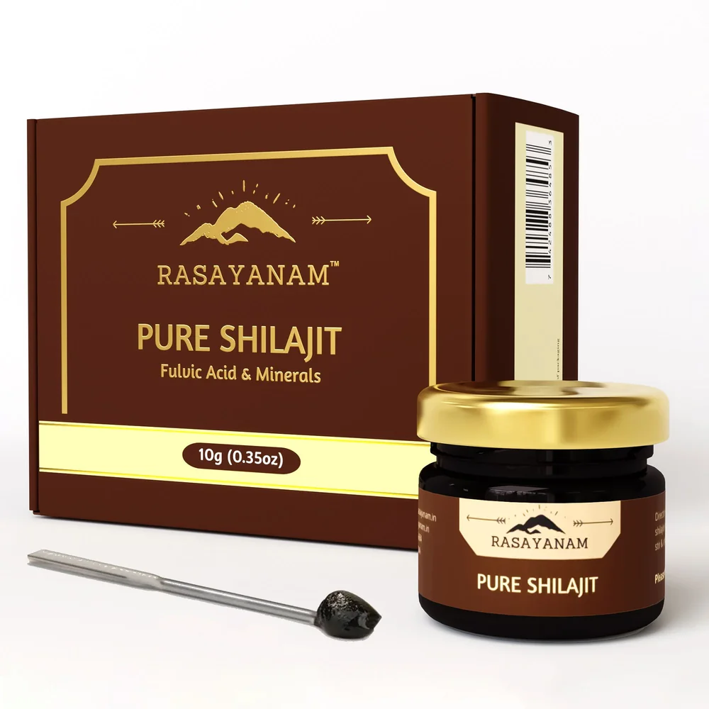 3D render of the Pure Shilajit 10g packaging: a brown box with gold lettering and border, a jar with a gold lid, and a spatula with resin.